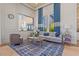 Comfortable lounge with elegant decor, plush seating, and scenic window views at 5770 Long Shore Loop, Sarasota, FL 34238