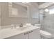 Bathroom featuring white sink vanity and glass shower at 603 Cedars Ct, Longboat Key, FL 34228