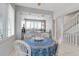 Charming dining area adjacent to a modern kitchen with bar stool seating at 603 Cedars Ct, Longboat Key, FL 34228