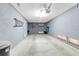 Spacious garage with grey walls and plenty of room for parking and storage at 603 Cedars Ct, Longboat Key, FL 34228