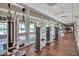 Modern gym with state-of-the-art equipment and large windows overlooking the community at 603 Cedars Ct, Longboat Key, FL 34228