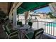 Relax on the covered patio with views of the pool and outdoor bar, perfect for entertaining guests at 603 Cedars Ct, Longboat Key, FL 34228