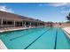 Sparkling community pool with ample deck space and a clubhouse perfect for a relaxing swim at 603 Cedars Ct, Longboat Key, FL 34228
