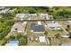 Single-Gathering home featuring lush trees and landscaping nestled in a friendly neighborhood setting at 6146 Grandeur St, Englewood, FL 34224