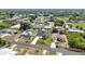 Single-Gathering home featuring well-kept landscaping nestled in a friendly neighborhood with mature trees at 6146 Grandeur St, Englewood, FL 34224