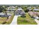 Aerial view of this beautifully landscaped single-story home with a long drive at 6146 Grandeur St, Englewood, FL 34224