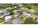 Single-Gathering home featuring lush trees and landscaping nestled in a friendly neighborhood setting at 6146 Grandeur St, Englewood, FL 34224