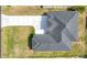 An aerial view of the house's roof showing a new roof installation and freshly poured driveway at 6146 Grandeur St, Englewood, FL 34224