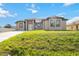 Stunning single-story home with a spacious driveway and meticulously maintained front yard at 6146 Grandeur St, Englewood, FL 34224