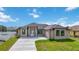 Charming single-story home with a well-manicured lawn at 6146 Grandeur St, Englewood, FL 34224