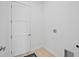 A clean laundry room features a utility sink and a door at 6146 Grandeur St, Englewood, FL 34224