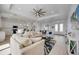 Open-concept living area with views of the kitchen, dining area, and front entry at 6146 Grandeur St, Englewood, FL 34224