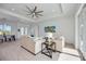 Living room with comfortable seating, modern decor, and access to the dining area at 6146 Grandeur St, Englewood, FL 34224