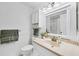 Bright bathroom vanity with decorative accents and ample lighting at 6701 12Th W Ave, Bradenton, FL 34209