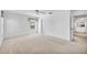 Bright bedroom with neutral carpet, ceiling fan, and natural light at 6701 12Th W Ave, Bradenton, FL 34209
