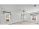 Bedroom with multiple windows offering ample natural light and ceiling fan at 6701 12Th W Ave, Bradenton, FL 34209