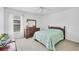 Cozy bedroom with a wooden dresser and comfortable bed at 6701 12Th W Ave, Bradenton, FL 34209