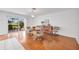 Dining area with sliding glass doors and hardwood flooring at 6701 12Th W Ave, Bradenton, FL 34209