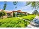 Beautiful home exterior showcasing well-manicured lawn and landscaping, creating a welcoming and picturesque setting at 6701 12Th W Ave, Bradenton, FL 34209