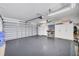 Spacious garage with epoxy flooring, ample storage cabinets, and a workbench, perfect for hobbies and projects at 6701 12Th W Ave, Bradenton, FL 34209