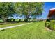 Lush green grounds with mature trees, offering a serene and peaceful environment for residents to enjoy at 6701 12Th W Ave, Bradenton, FL 34209