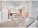 Spacious kitchen featuring white cabinets, and a ceiling fan, offering plenty of counter space at 6701 12Th W Ave, Bradenton, FL 34209