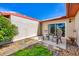 Private patio with chairs, decorative stone, and lush greenery, ideal for relaxing outdoors at 6701 12Th W Ave, Bradenton, FL 34209