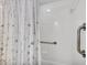 Accessible shower with safety bars and elegant shower curtain at 6701 12Th W Ave, Bradenton, FL 34209