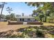 Backyard featuring brick paver patio with seating in a grassy private setting at 6766 Beedla St, North Port, FL 34291