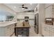 Bright kitchen featuring stainless steel appliances, custom cabinets, and a stylish kitchen island at 6766 Beedla St, North Port, FL 34291