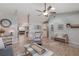 Bright living room with stylish furnishings, neutral decor, and wood-look flooring at 6766 Beedla St, North Port, FL 34291