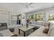 Inviting living room with neutral tones, comfortable seating and sliding glass doors to outdoor area at 6766 Beedla St, North Port, FL 34291