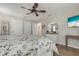 Spacious main bedroom with neutral colors, wood-look flooring, and tasteful decor at 6766 Beedla St, North Port, FL 34291