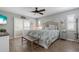 Serene main bedroom with floral bedding, natural light and wood-look flooring at 6766 Beedla St, North Port, FL 34291