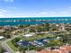Community aerial view showing water access, single Gathering homes, and landscaping at 709 Sorrento Inlt # 709, Nokomis, FL 34275