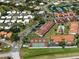 Aerial view of community featuring pool, tennis courts and marina at 709 Sorrento Inlt # 709, Nokomis, FL 34275