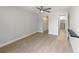 Spacious bedroom with light wood floors, ceiling fan and walk-in closet; ready to be styled at 709 Sorrento Inlt # 709, Nokomis, FL 34275