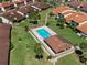 Aerial view of a community pool with lounge chairs and covered seating area at 709 Sorrento Inlt # 709, Nokomis, FL 34275