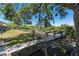 Picturesque waterfront view of a community dock and boat slip amidst lush greenery at 709 Sorrento Inlt # 709, Nokomis, FL 34275
