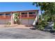Exterior view of a townhome featuring a charming balcony, garage, and landscaped yard at 709 Sorrento Inlt # 709, Nokomis, FL 34275