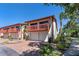 Two-story condominium featuring a 2-car garage and front balcony at 709 Sorrento Inlt # 709, Nokomis, FL 34275