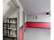 Garage with shelving, painted walls and floor, and side door to the outside at 709 Sorrento Inlt # 709, Nokomis, FL 34275