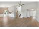 Open living room featuring wood-look floors, high ceilings, and ample natural light at 709 Sorrento Inlt # 709, Nokomis, FL 34275