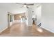 Bright living room featuring wood-look floors, high ceilings, and lots of natural light at 709 Sorrento Inlt # 709, Nokomis, FL 34275