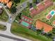 Aerial view of tennis courts and common areas within a residential community at 709 Sorrento Inlt # 709, Nokomis, FL 34275