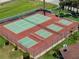 Aerial view of tennis and pickleball courts in a gated residential community at 709 Sorrento Inlt # 709, Nokomis, FL 34275
