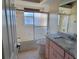 Bathroom with granite vanity and a shower/tub combo at 7102 52Nd E Dr, Bradenton, FL 34203