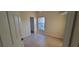 This bedroom features tile floors, neutral walls, and a window for natural light at 7102 52Nd E Dr, Bradenton, FL 34203
