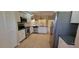 Well-equipped kitchen featuring stainless steel appliances, a tile floor, and granite countertops at 7102 52Nd E Dr, Bradenton, FL 34203