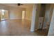 A spacious and bright living room featuring tile flooring, neutral walls, and access to a sunroom at 7102 52Nd E Dr, Bradenton, FL 34203